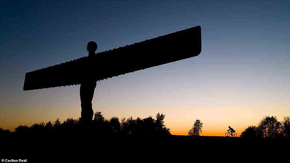 Carlton is pictured here cycling past the Angel of the North on his way home from his waggonway wanderings