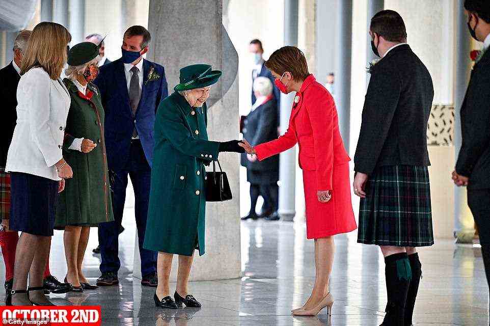 October 2 -- Queen Elizabeth II shakes hands with First Minister Nicola Sturgeon as Camilla, Duchess of Cornwall looks on at the opening of the sixth session of the Scottish Parliament