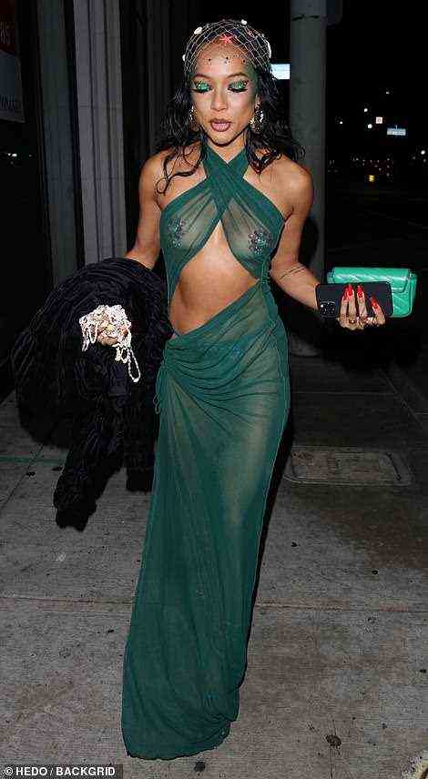 Posing: Karrueche certainly sizzled up a storm for onlookers