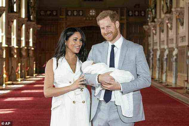 Meghan and Harry are pictured with their newborn son Archie at Windsor Castle on May 8, 2019