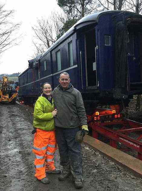 Di and Simon overseeing the installation of one of the carriages