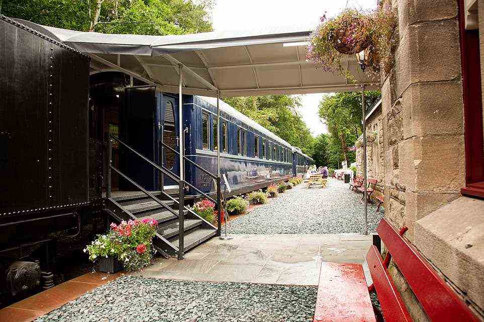 This shot showcases the back of the tender and the start of the baggage carriage. In the main station building to the right of this image visitors can see the old ticket office and post office room, which has been decorated with dozens of train jigsaw pictures provided by the owner’s mum and her friends