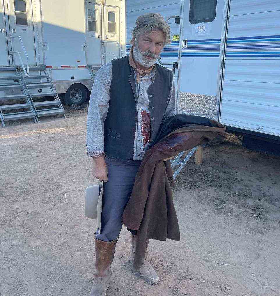 Alec Baldwin is seen on the set of Rust with fake blood earlier Thursday, hours before he shot and killed the film's cinematographer. Filming was halted following the fatal incident at the Bonanza Creek Ranch movie set in Santa Fe