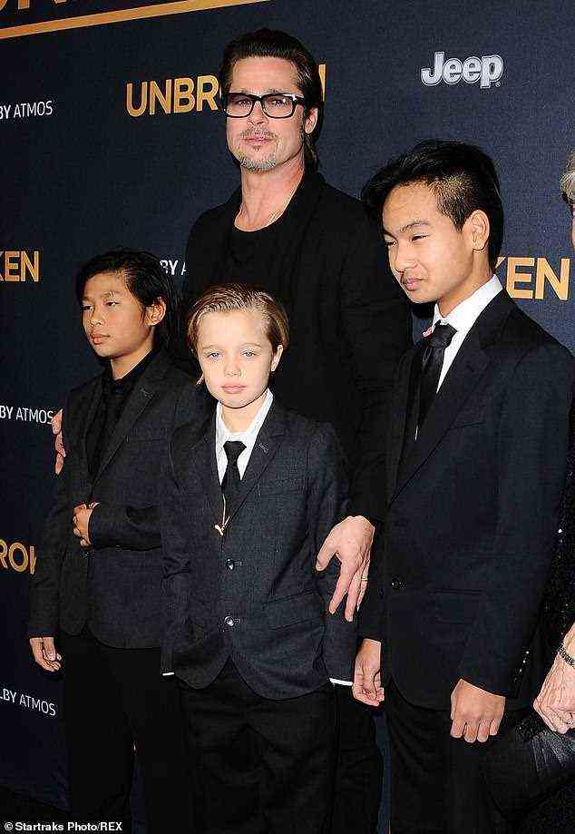 Star: Shiloh is seen with her dad Brad and brothers Pax and Maddox in 2014