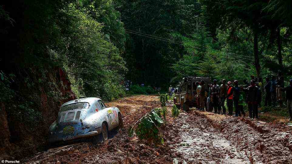 Brinkerhoff and her Porsche photographed battling through the mud in Kenya during the opening day of the 2019 East African Safari Classic Rally