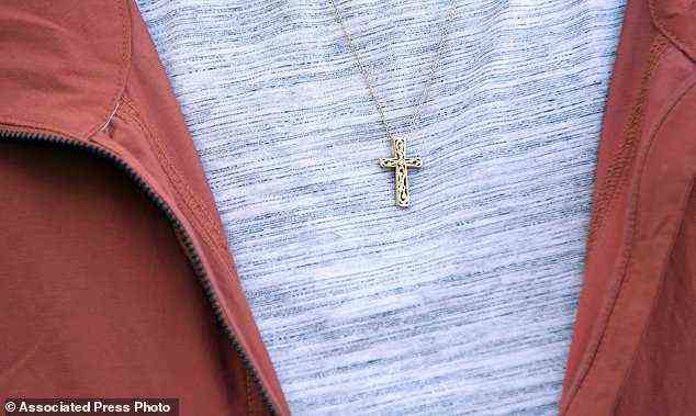 Leilani Lutali wears a cross around her neck at her home in Colorado Springs, Colorado
