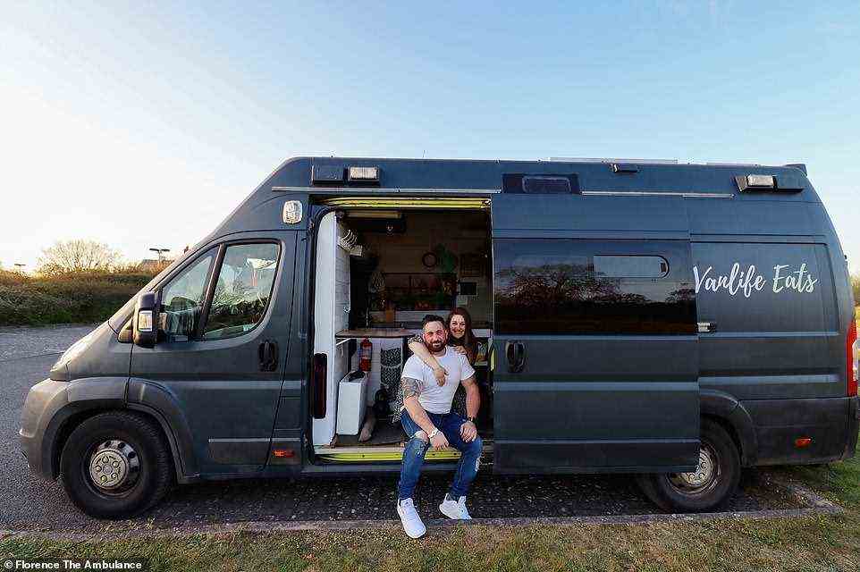 Mark and Sophie pictured outside their ex-ambulance, which Mark bought for £5,000 in May 2019