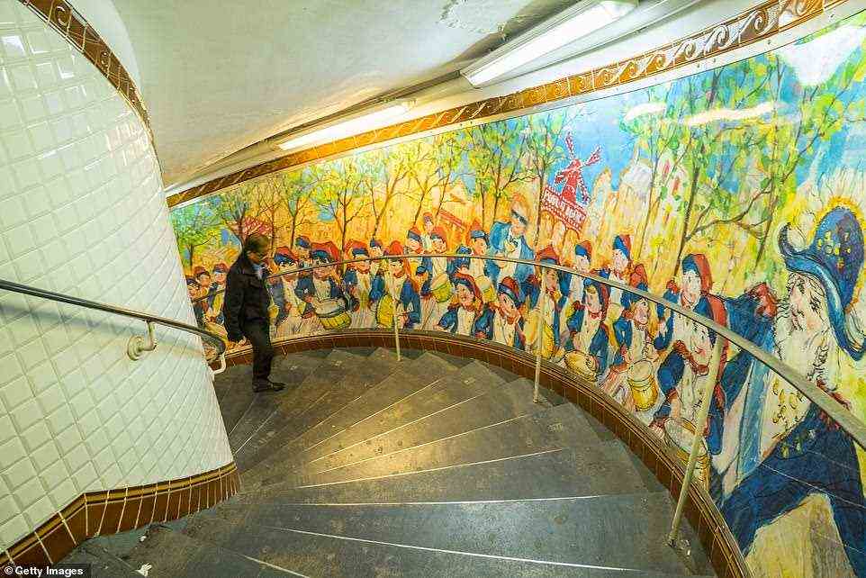 Culture: A Metro mural depicting Parisienne life. 'The Paris Metro is beautiful,' says Andrew