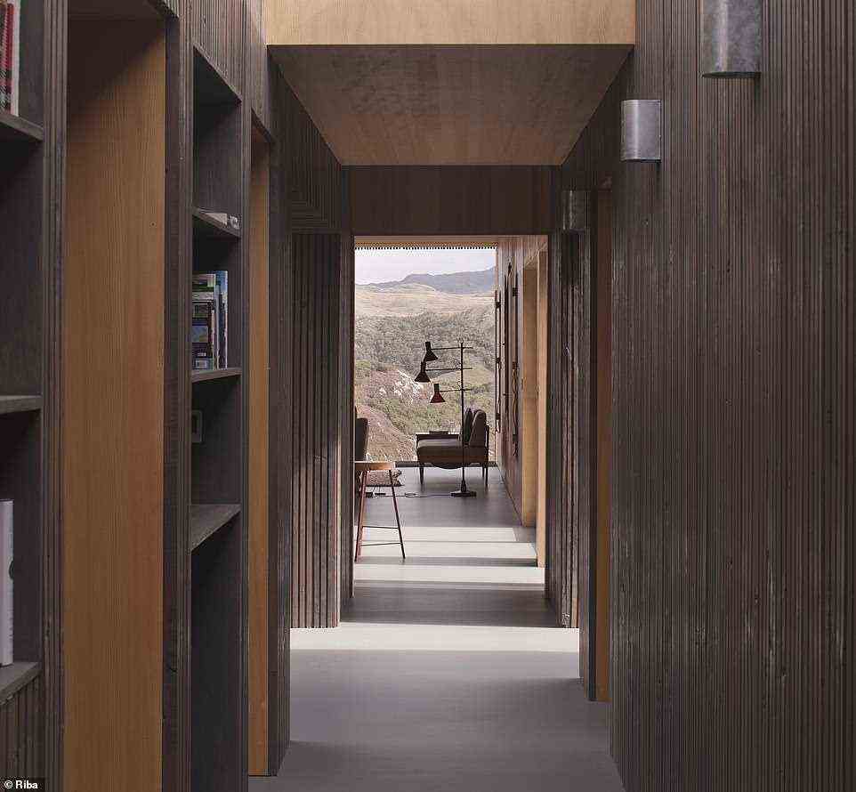 House in Assynt in Perthshire was described as an 'unforgettable' experience by the jury. Pictured, the hallway leading to the living room shows the large windows and incredible views
