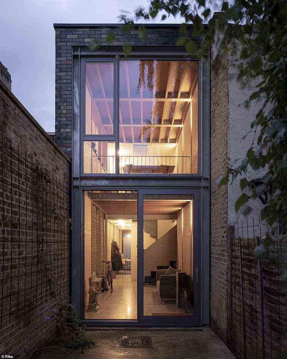 The Slot House in London is a tiny home made large by clever design, making the most of the small building built in a tight spot in the heavily populated city