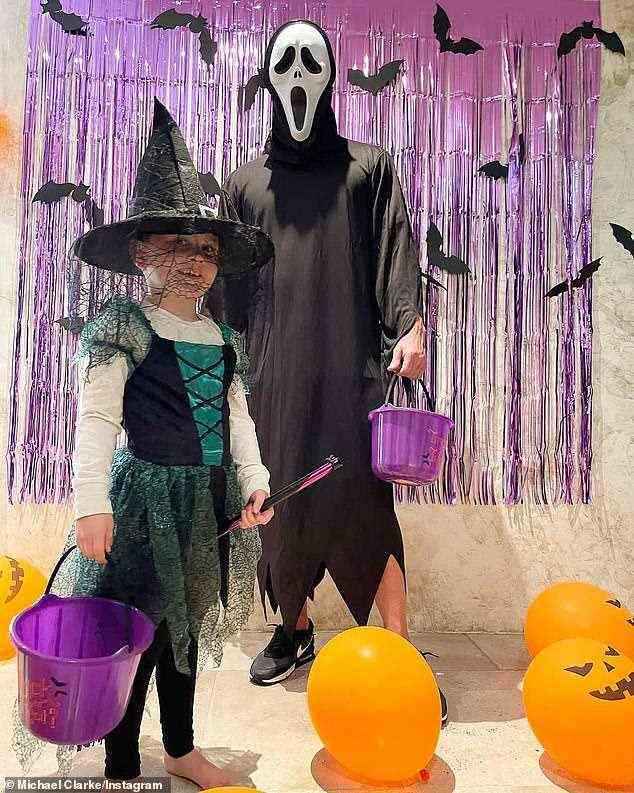 Get ready to scream: Former cricketer Michael Clarke opted for a Scream mask for his costume while daughter Kelsey-Lee, five, went as a witch
