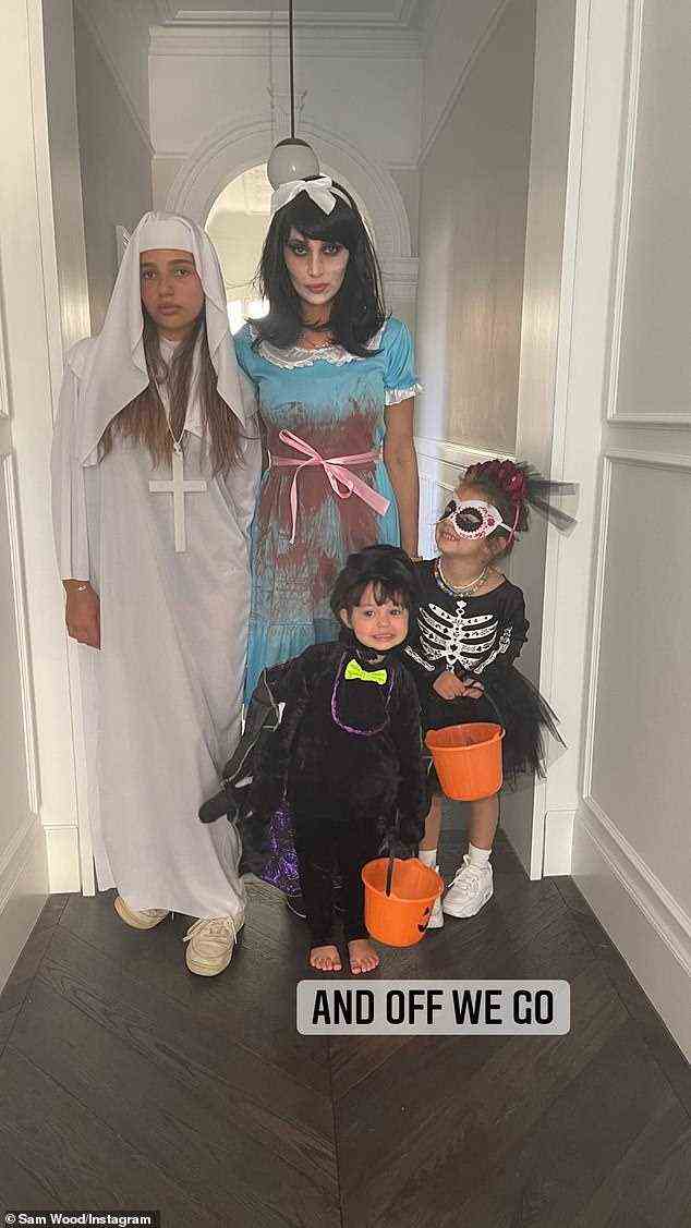 Scary: The entire family got into the spirit of Halloween including Eve, 15, and the kids Charlie and Willow, who both carried buckets for trick or treat