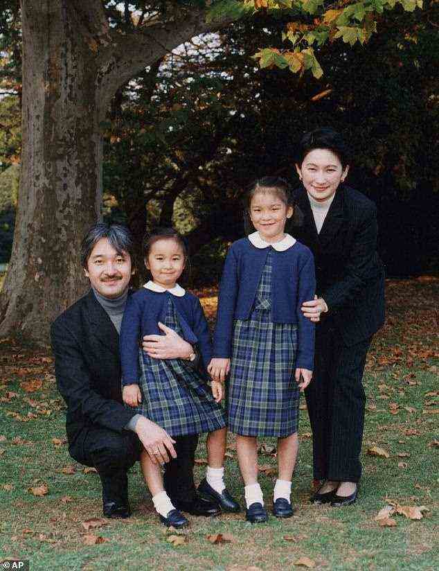 Mako, the eldest daughter of Crown Prince Fumihito and niece of Emperor Naruhito, has chosen love over her duties as a royal, and place within the family. Pictured, Mako, right, with her parents and younger sister Kako at t Akasaka Palace in Tokyo in 1999