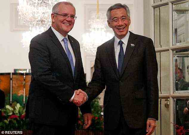 Scott Morrison kündigte die Einigung in Rom auf dem G20-Gipfel an, nachdem er mit seinem singapurischen Amtskollegen Lee Hsien Loong (zusammen im Bild 2019) gesprochen hatte.