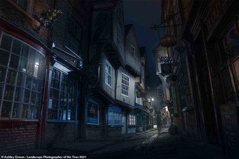 This evocative shot shows what's said to be the inspiration for Diagon Alley in the Harry Potter movies - the Shambles in York, where buildings date back as far as the 14th century. It's titled 'Ghosts of York' and was taken at 5am by photographer Ashley Groom, who Landscapes at Night category - at 5am in the morning