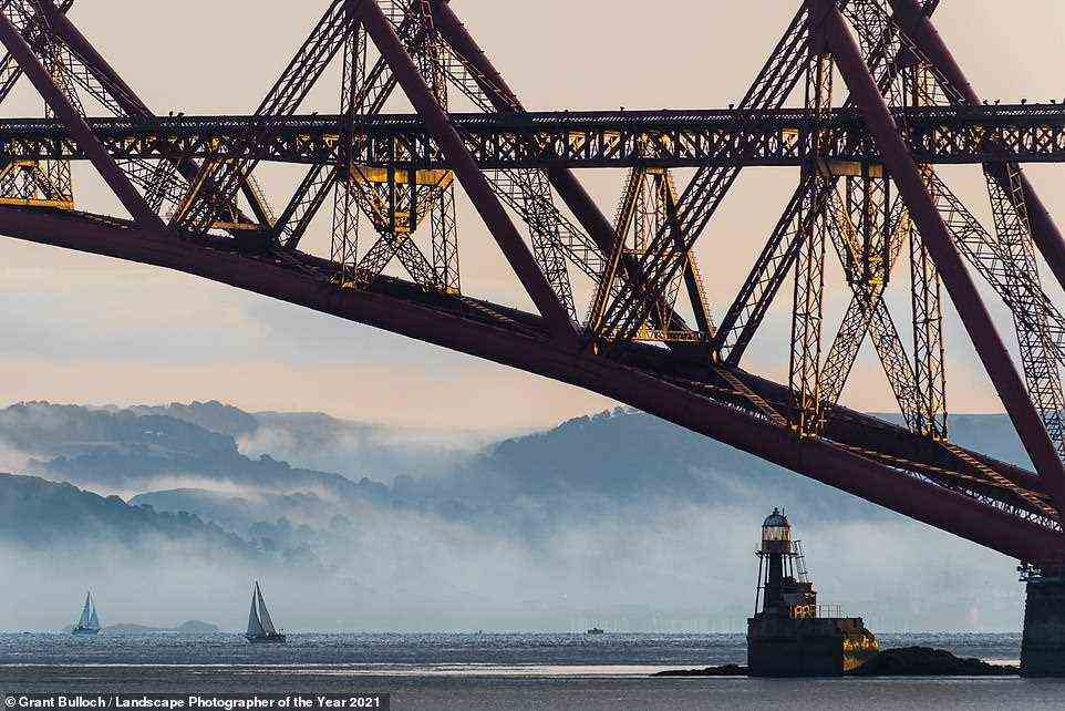 Low mist and cloud tumble down from the hills of Fife behind a railway bridge in Scotland that needs little introduction - the Forth Bridge. It is commended in the Lines in the Landscape category and was captured by Grant Bulloch. The judges add that the yachts give the picture an extra dimension