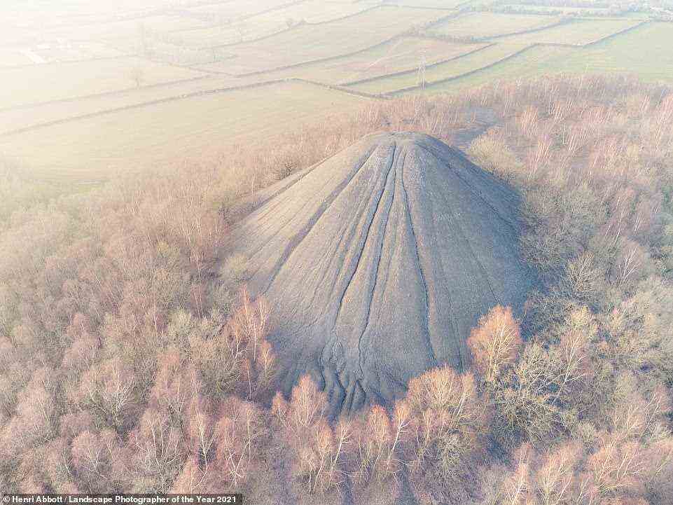 A stunning drone shot of the incredible volcano-shaped mound of waste mining material in Somerset, near the village of Paulton, known as The Batch. It was taken by Henri Abbott and wins the Classic View Youth category