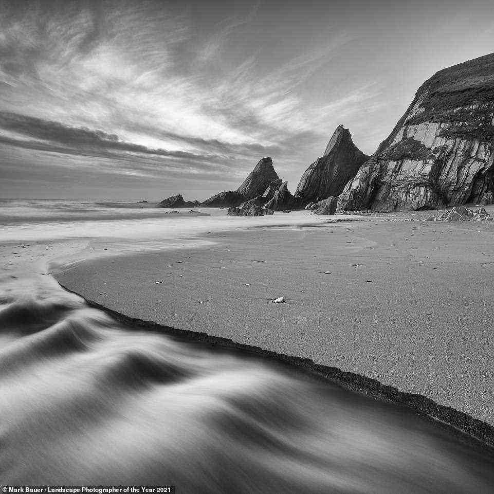 A mesmerising shot taken on the Devon coast that earns Mark Bauer a commended accolade in the Black and White category. He says: 'I'd hoped for a colourful sunset, but when the sun dipped into thick haze on the horizon, it clearly wasn't going to happen. So I opted for black and white and a composition based around the strong shapes and textures in the bay'