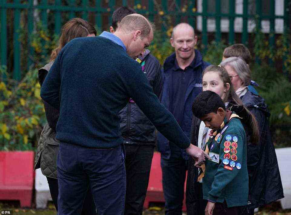 Prince William appeared particularly impressed by one young Scouts collection of badges, and  could be seen gesturing to several