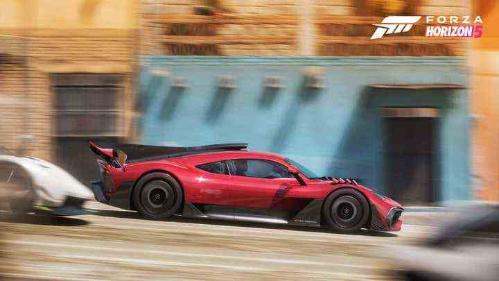 A red car drives fast in Forza Horizon 5.