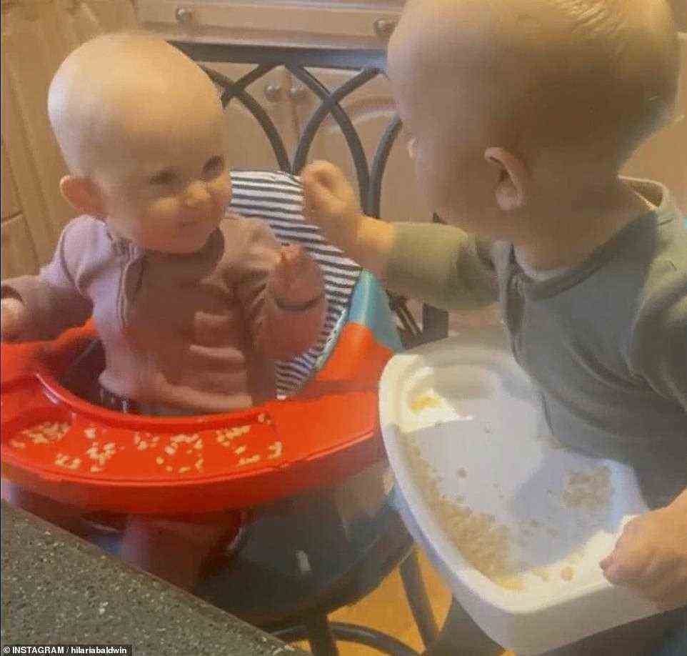Hilaria and Alec's two youngest children, Edu and Lucia, were seen feeding one another while sitting in the kitchen of their rural hideaway
