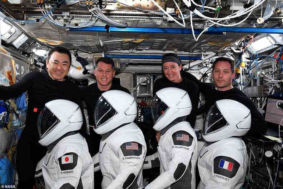 NASA's Shane Kimbrough (2nd left) and Megan McArthur (2nd right), along with the European Space Agency's (ESA) Thomas Pesquet (right) and Japan Aerospace Exploration Agency's (JAXA) astronaut Akihiko Hoshide (left) are all wearing diapers for their return trip
