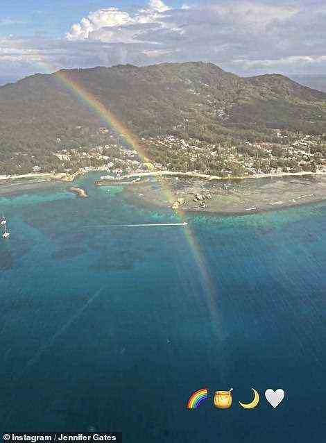 Paradise! She also shared a photo of a rainbow over a tropical island