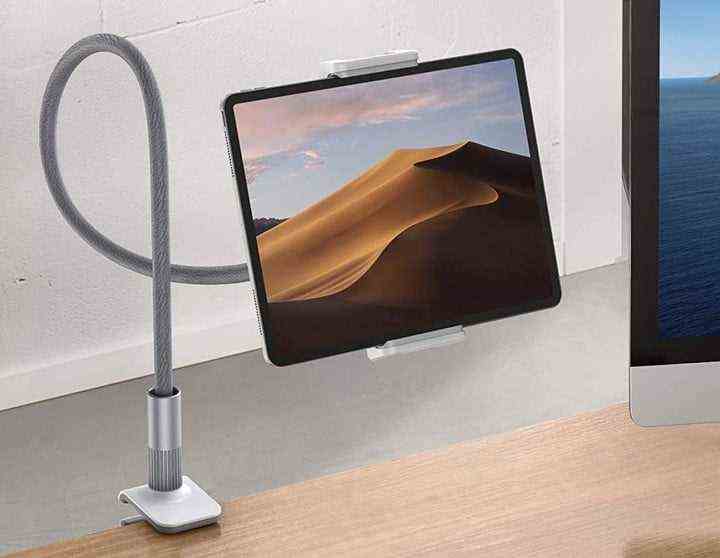 The Lamicall Gooseneck Tablet Holder holding an iPad at a desk.