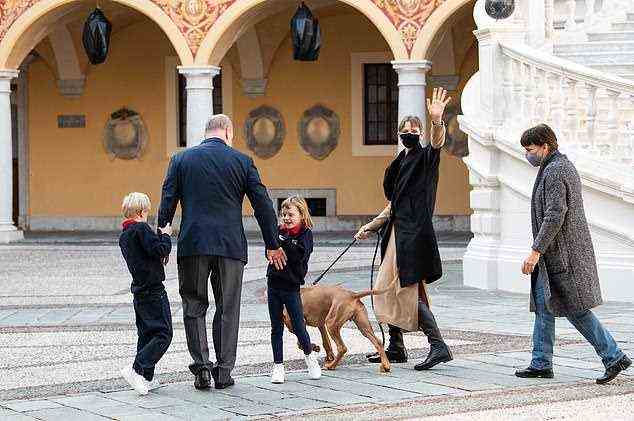 Carefully choreographed: Albert, 63, was waiting for her at the Monte Carlo helipad, along with their six-year-old twins, Princess Gabriella and Prince Jacques. The family were joined by a hand-picked photographer inside the Palace walls for the 'reunion' photos, pictured