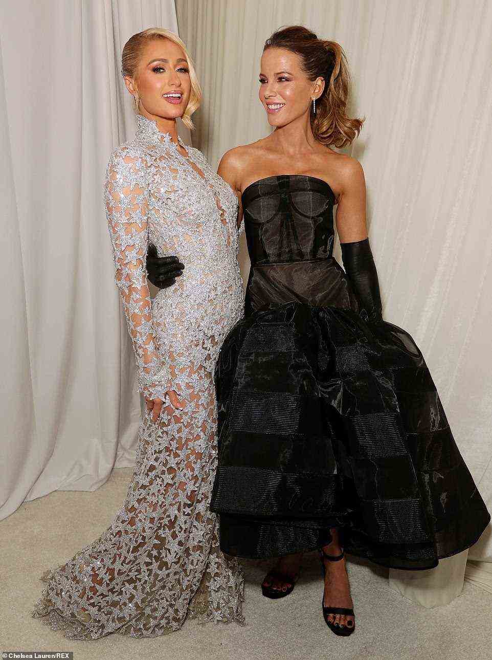 Famous friends: Paris posed with her friend, A-list actress Kate Beckinsale, who wowed in black