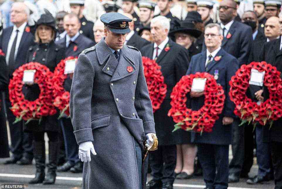 The Duke of Cambridge walks past dignitaries holding wreaths after he laid his wreath at the Cenotaph this morning
