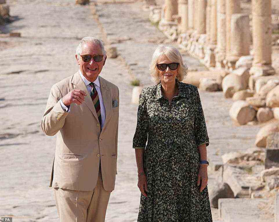 Charles breaks into a smile as the couple pose for photos on the main avenue of the historic site, which features in the bible