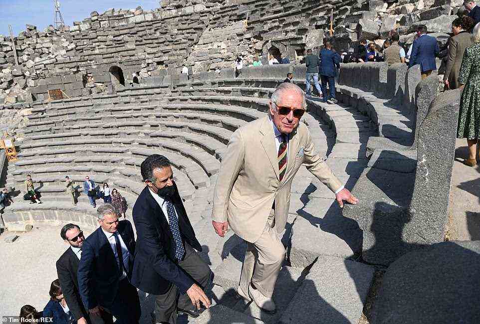 Best foot forward! A significant entourage accompanied the couple as they climbed the steps of the historic amphitheatre in the Middle Eastern ancient metropolis, which lies 74 miles north of the Jordanian capital