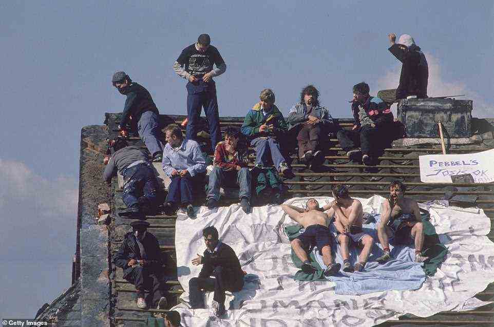 Tom Stoddart wasn't just known for his exceptional coverage of global issues but also took iconic images from the biggest news stories in the UK. Pictured: Prisoners on the rooftop of Strangeways Prison, in Manchester, during a riot in April 1990