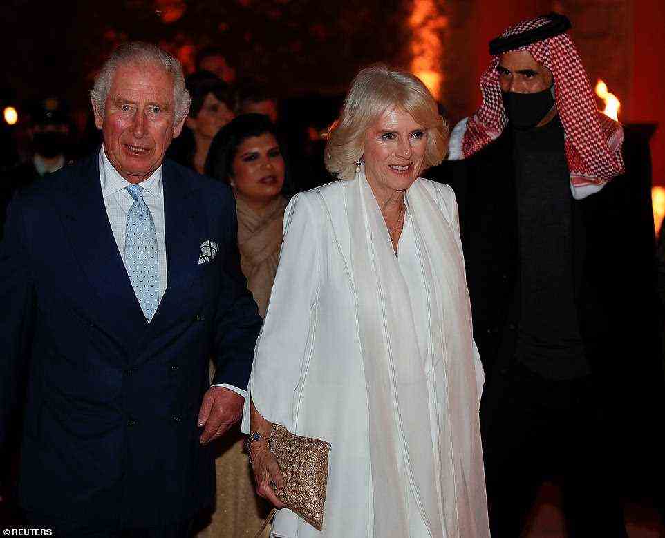 For their glamourous evening in Amman, Charles changed to a blue suit, a crisp white shirt and pale blue tie, while Camilla opted for a ethereal white outfit