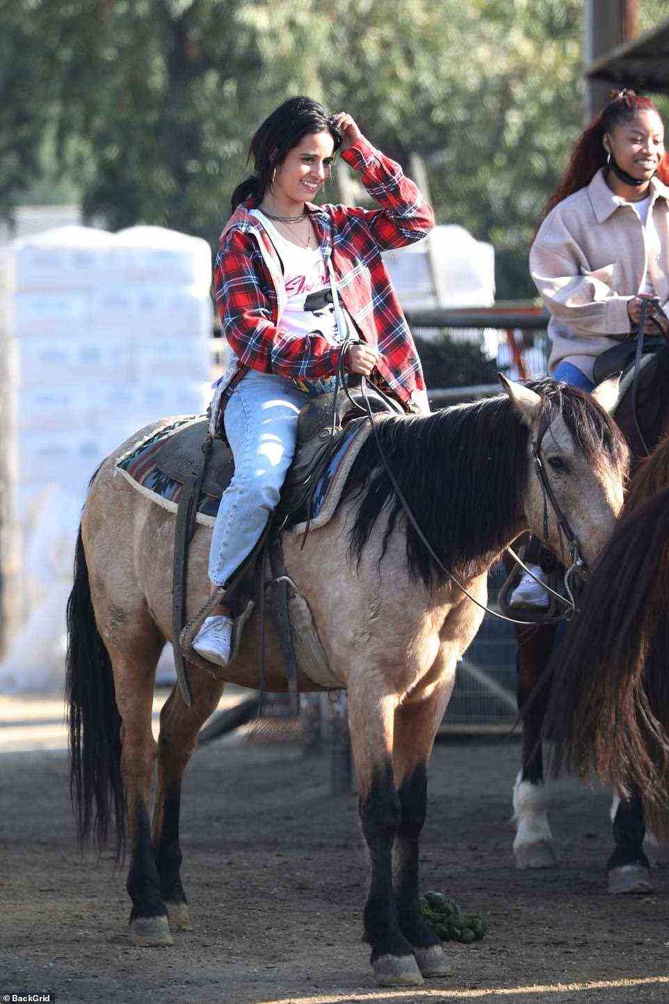 Just vibes: Camila certainly seemed to enjoy the day of horseback riding as she looked completely at ease while atop the four-legged animal