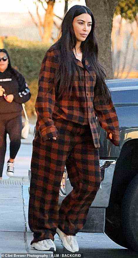 Night and day: Kim's sleepover attire was a fire cry from some of the edgy haute couture ensembles she has worn in public recently