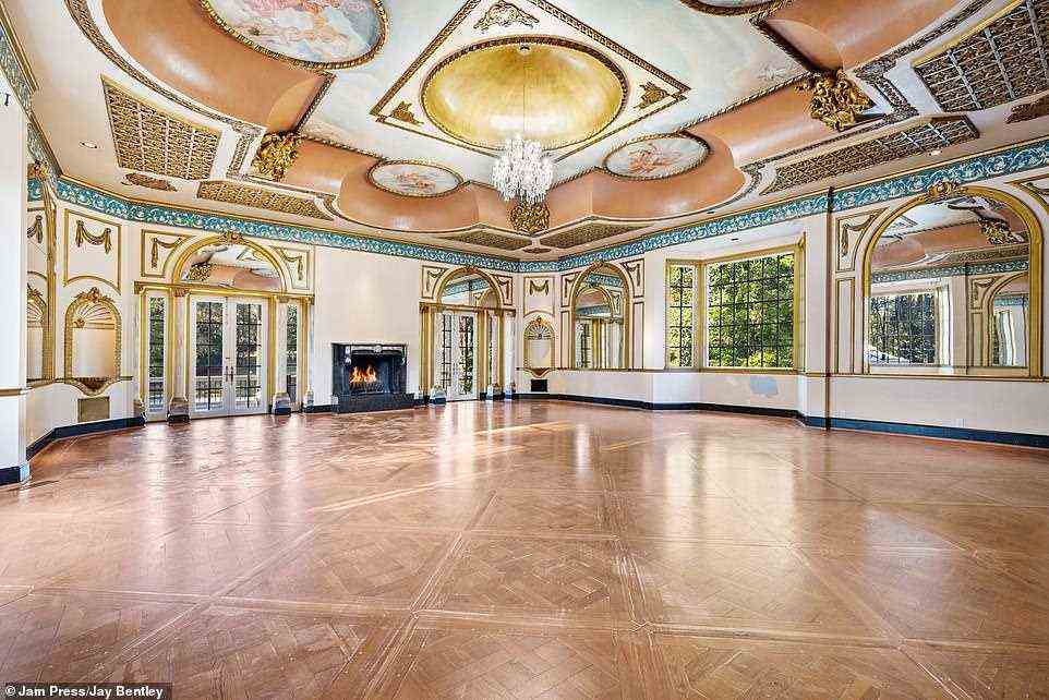 Let's dance! Photos show an extravagant ballroom, the ceilings of which are decorated with art and gilded accents, with a walk-out veranda to host events year-round