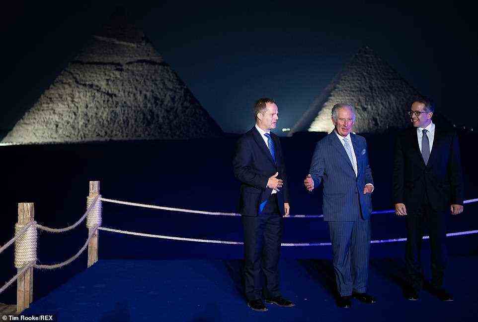 Prince Charles looked in great spirits tonight as he admired the Pyramids with Dr Khaled Al Anan, right, after a day busy with engagements