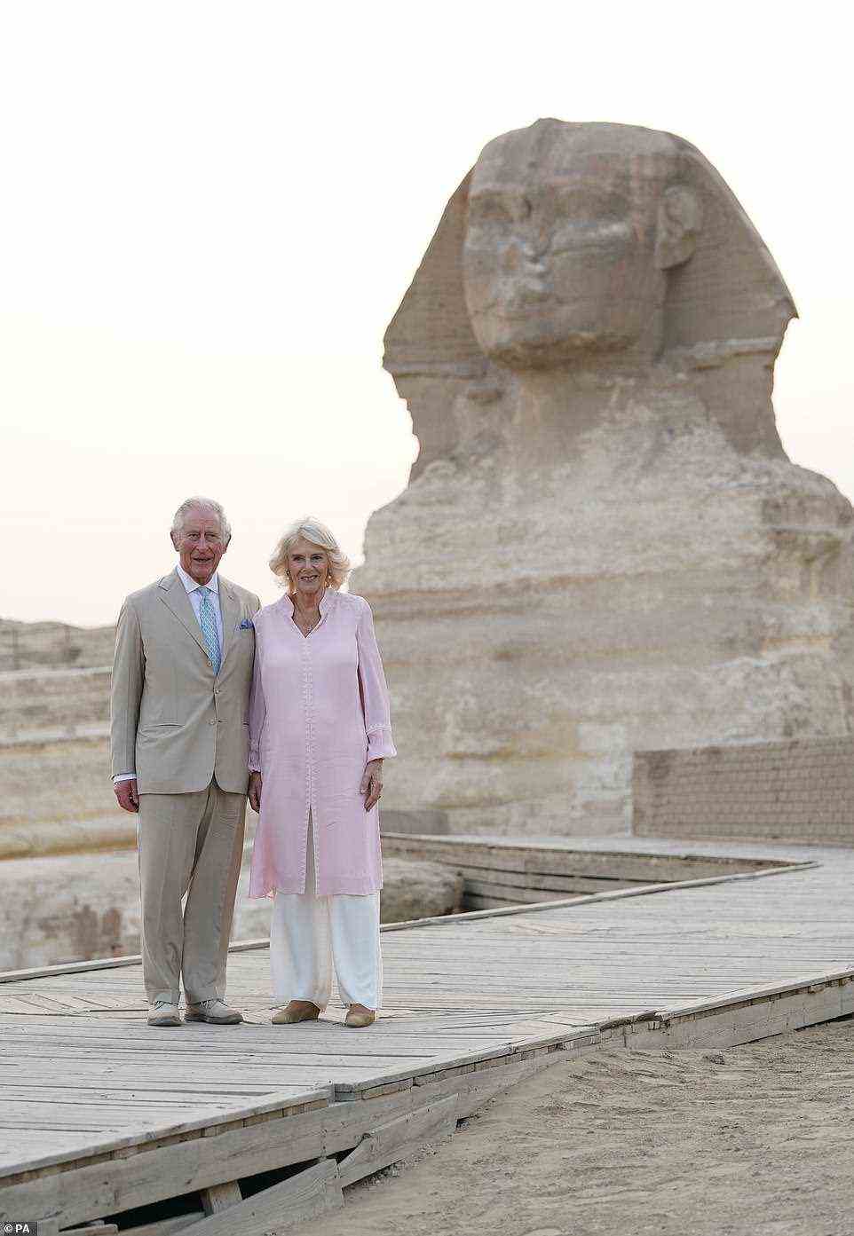 Strike a pose! The Prince of Wales and the beaming Duchess of Cornwall posed together during a visit to the Great Sphinx of Giza (pictured)