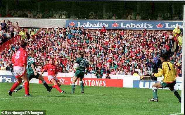 Teddy Sheringham of Nottingham Forest fires past David James of Liverpool to score the only goal in a 1-0 win for Forest in the first Premier League game to be televised on Sky. Since then revenues have rocketed in the Premier League (below) and left the EFL trailing in their wake