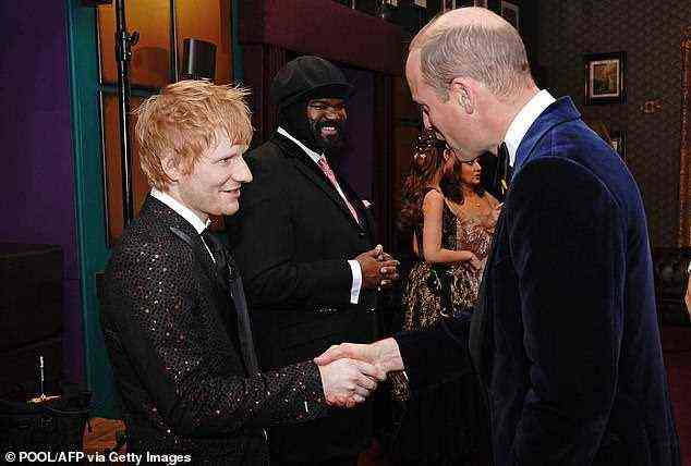 Prince William speaks with singer-songwriter Ed Sheeran after the Royal Variety Performance