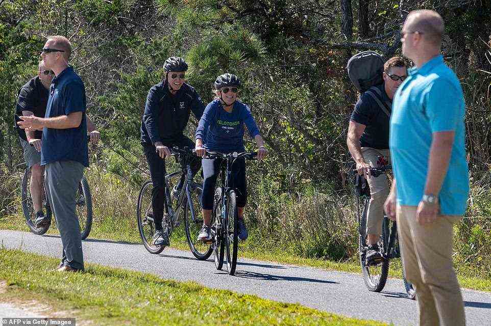 Joe and Jill Biden stay physically active - above they ride their bikes through Cape Henlopen State Park in Rehoboth Beach, Delaware, in September 2019