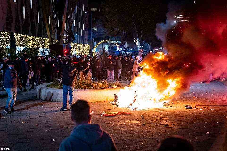 Pictured: A scooter set on fire during a protest against the 2G policy in Rotterdam, Netherlands, which took place last night