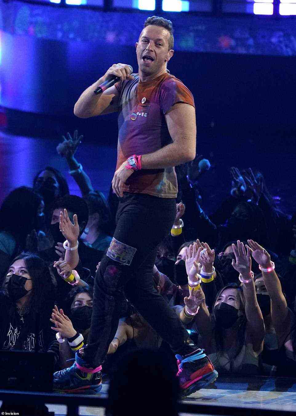 Down with the kids: Chris Martin of Coldplay performs My Universe at the American Music Awards
