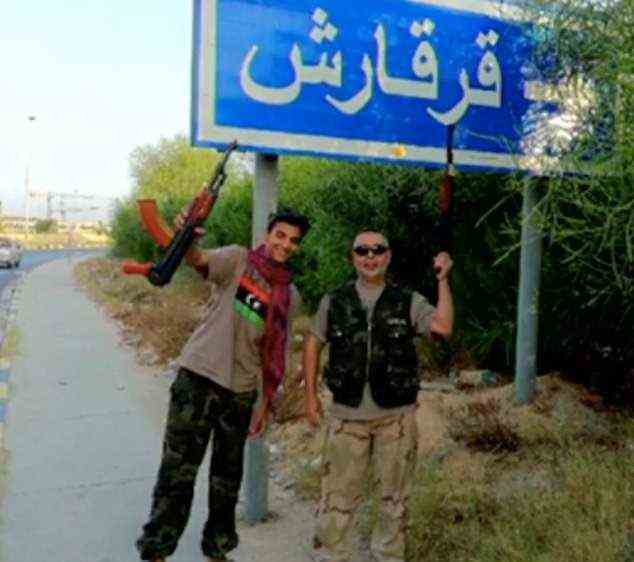 Another photo shows Ismail and Ramadan Abedi pose with machine guns in Libya