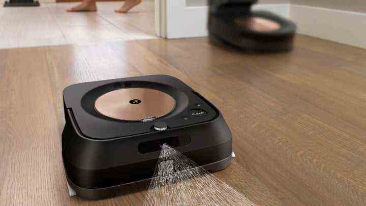 iRobot Roomba s9+ spraying water on the floor.