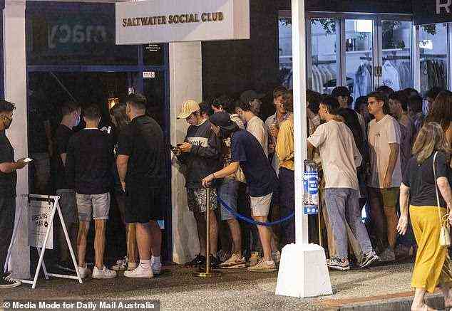 Time to kill: Lines to get into various clubs and pubs around the town filled up early on Saturday