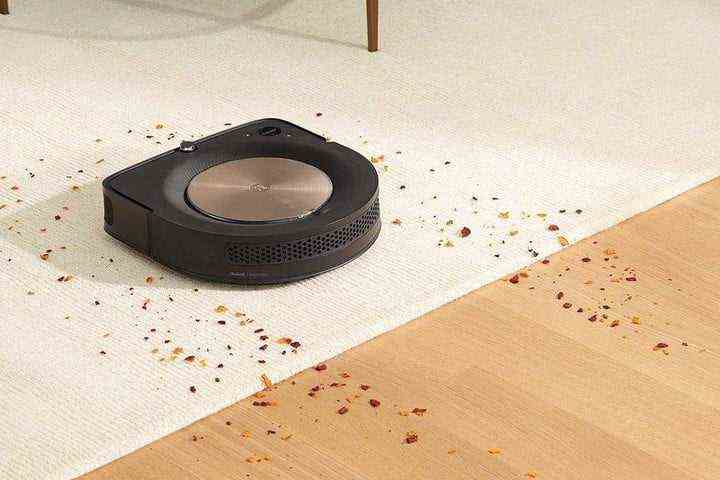 The iRobot Roomba s9 cleaning.