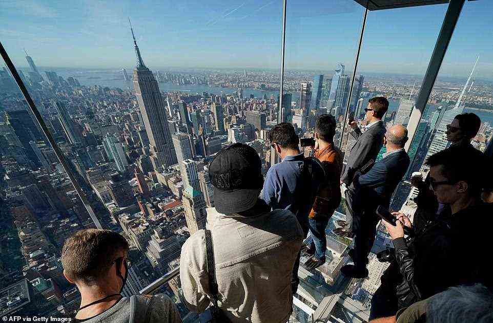 Visitors admire New York's dazzling skyline from the One Vanderbilt skyscraper in Midtown